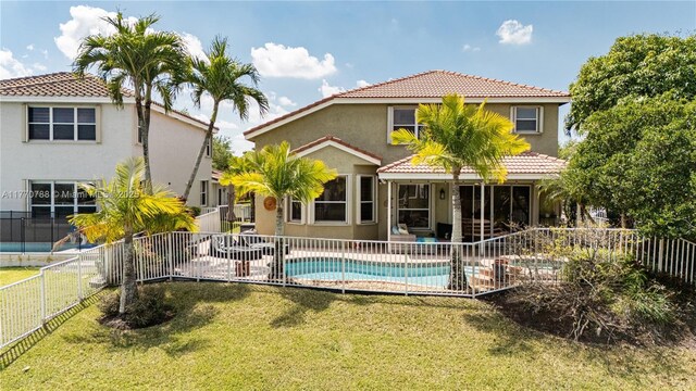16473 SW 30th St, Miramar, FL 33027 - rear view of property with stucco siding, a fenced backyard, a tile roof, and a patio