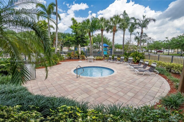 16473 SW 30th St, Miramar, FL 33027 - view of swimming pool featuring a patio area