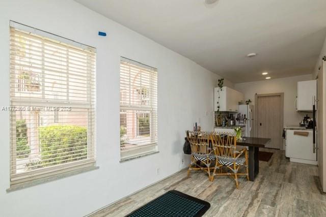 dining space featuring light wood-style floors