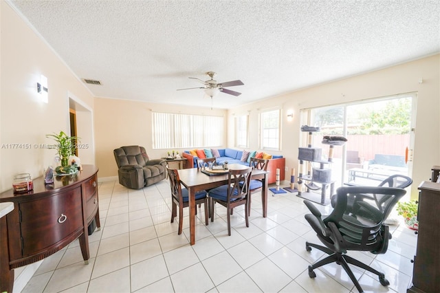 8110 NW 185th Ter, Hialeah, FL 33015 - dining area featuring visible vents, a textured ceiling, and a ceiling fan