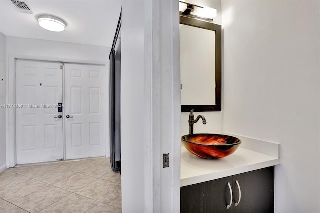 bathroom with vanity, tile patterned flooring, and visible vents
