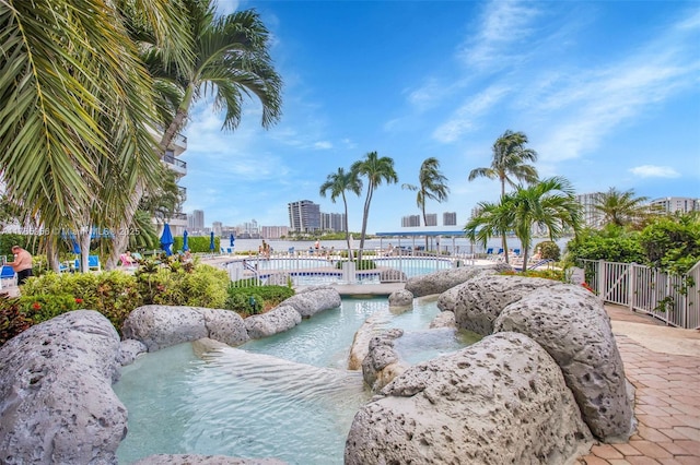 3530 Mystic Pointe Dr Unit 2903, Aventura, FL 33180 - community pool with a city view and fence