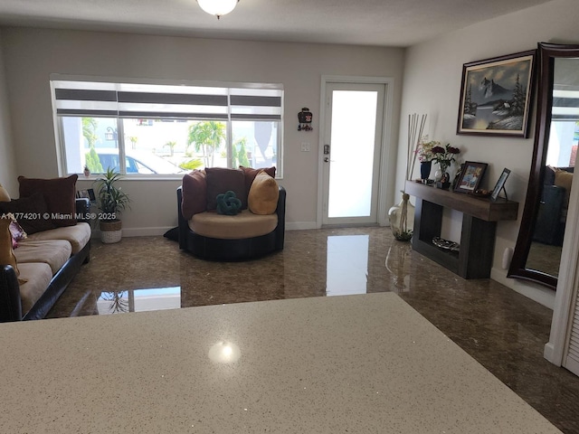 living room featuring baseboards