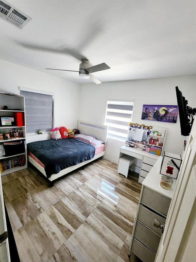 bedroom featuring visible vents and ceiling fan