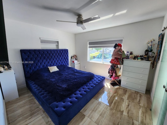 bedroom featuring wood finished floors and ceiling fan