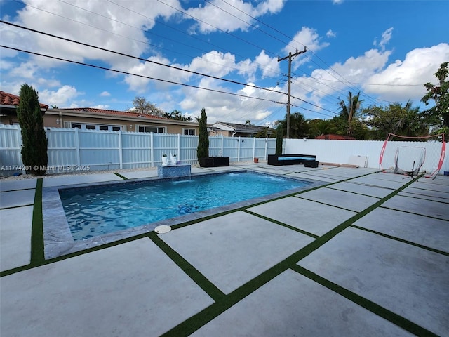 view of pool with a fenced in pool, a patio area, and a fenced backyard