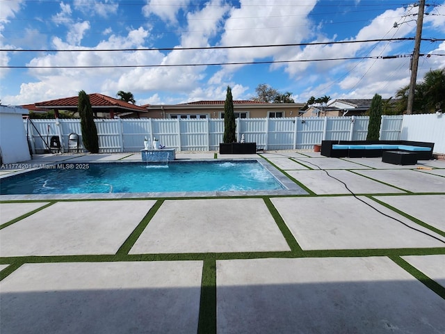 view of swimming pool featuring a patio, a fenced backyard, and a fenced in pool