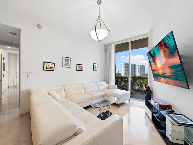15901 Collins Ave Unit 405, Sunny Isles Beach, FL 33160 - living room featuring floor to ceiling windows