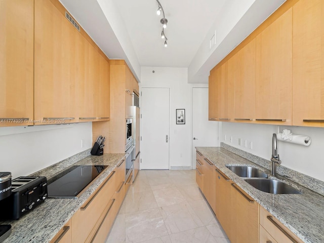 15901 Collins Ave Unit 405, Sunny Isles Beach, FL 33160 - kitchen with a sink, light stone counters, modern cabinets, black electric stovetop, and oven