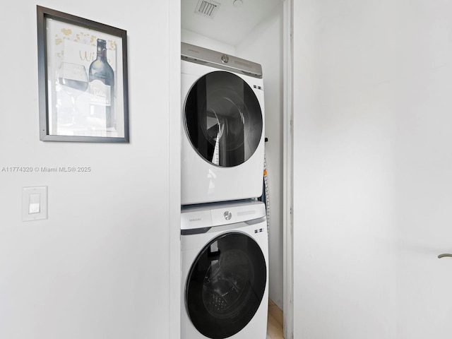 15901 Collins Ave Unit 405, Sunny Isles Beach, FL 33160 - washroom with stacked washing machine and dryer