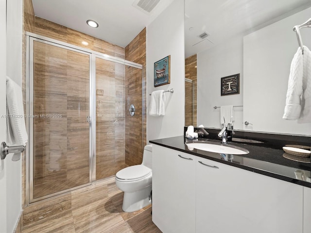 15901 Collins Ave Unit 405, Sunny Isles Beach, FL 33160 - bathroom with a shower stall, toilet, and vanity