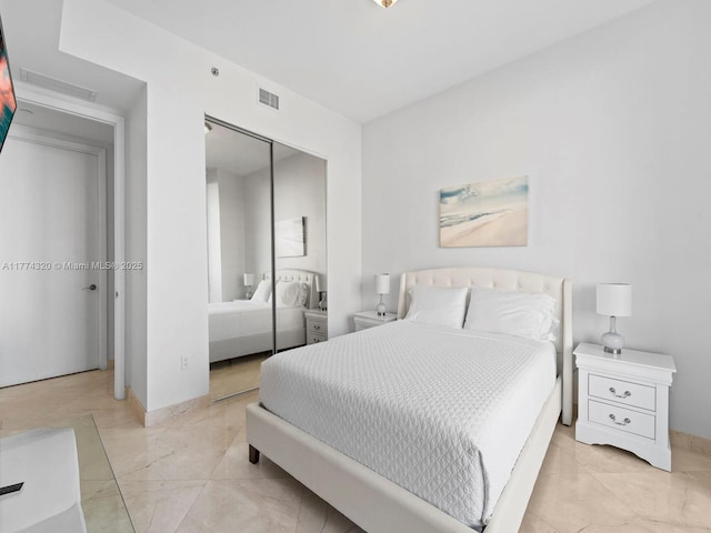 15901 Collins Ave Unit 405, Sunny Isles Beach, FL 33160 - bedroom with a closet, baseboards, and light marble finish floors