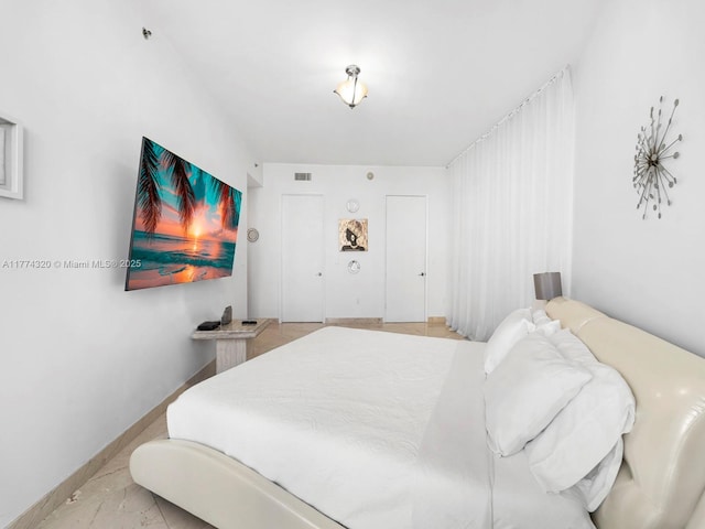 15901 Collins Ave Unit 405, Sunny Isles Beach, FL 33160 - bedroom featuring light marble finish flooring and baseboards