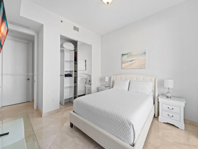 15901 Collins Ave Unit 405, Sunny Isles Beach, FL 33160 - bedroom featuring a closet, baseboards, and light marble finish flooring