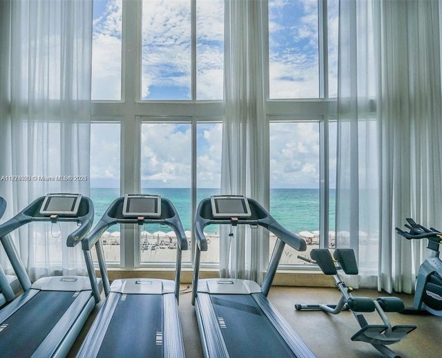 15901 Collins Ave Unit 405, Sunny Isles Beach, FL 33160 - workout area featuring a water view and a high ceiling