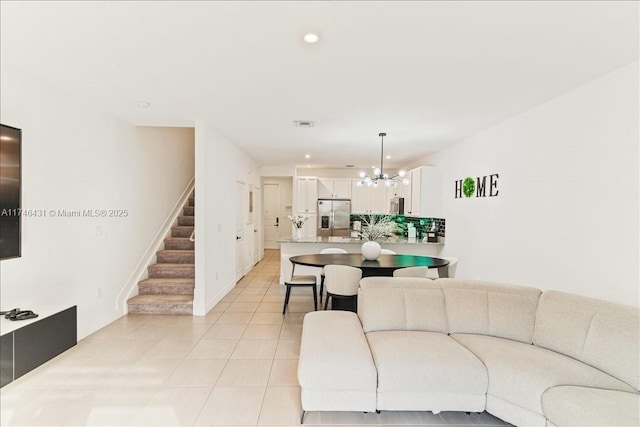 23300 SW 110th Ct, Homestead, FL 33032 - living area with recessed lighting, stairway, an inviting chandelier, and light tile patterned flooring