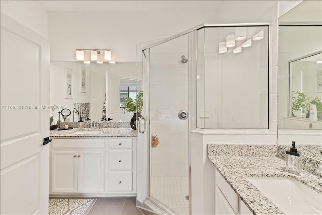 23300 SW 110th Ct, Homestead, FL 33032 - full bathroom with a sink, two vanities, a shower stall, and tile patterned floors
