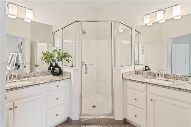 23300 SW 110th Ct, Homestead, FL 33032 - bathroom featuring a stall shower, two vanities, and a sink