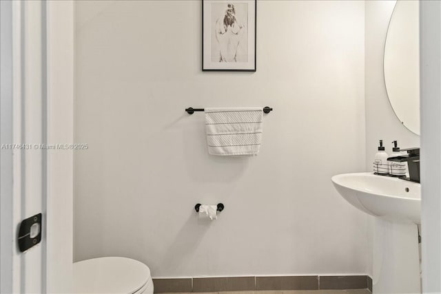 23300 SW 110th Ct, Homestead, FL 33032 - bathroom featuring toilet and baseboards