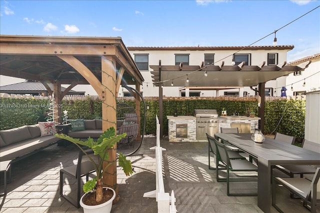 23300 SW 110th Ct, Homestead, FL 33032 - view of patio with outdoor dining space, exterior kitchen, outdoor lounge area, a gazebo, and a fenced backyard