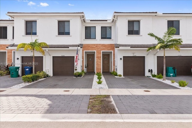 23300 SW 110th Ct, Homestead, FL 33032 - view of property with an attached garage, stucco siding, and driveway