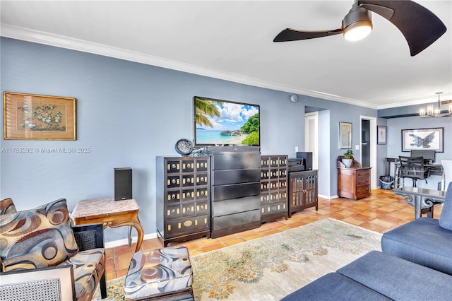 living area with ceiling fan with notable chandelier, tile patterned floors, baseboards, and ornamental molding