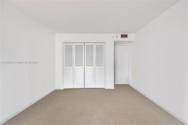 3031 N Ocean Blvd Unit 1804, Fort Lauderdale, FL 33308 - unfurnished bedroom featuring carpet floors and a closet