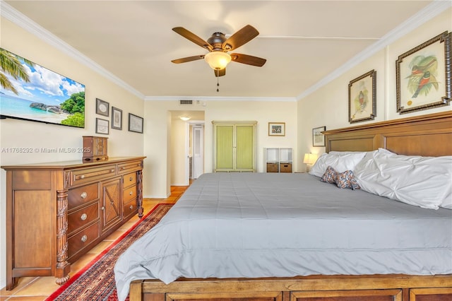 bedroom with ceiling fan, ornamental molding, and visible vents
