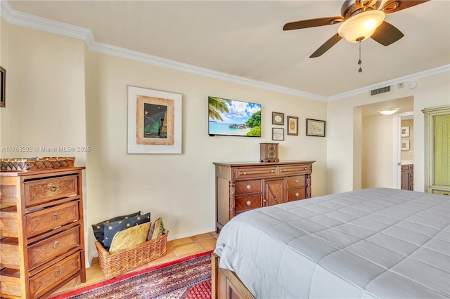 bedroom with baseboards, visible vents, tile patterned flooring, and crown molding