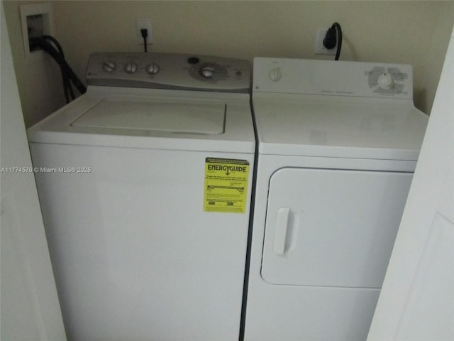 clothes washing area featuring laundry area and independent washer and dryer