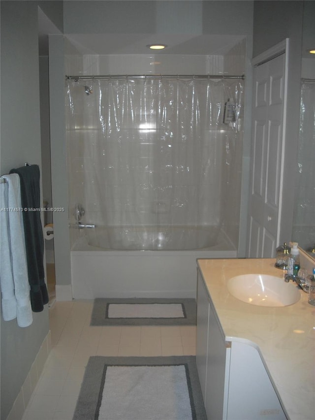 full bath with vanity, tile patterned flooring, and shower / bath combo