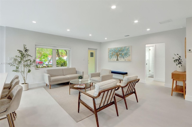 living room featuring recessed lighting and baseboards