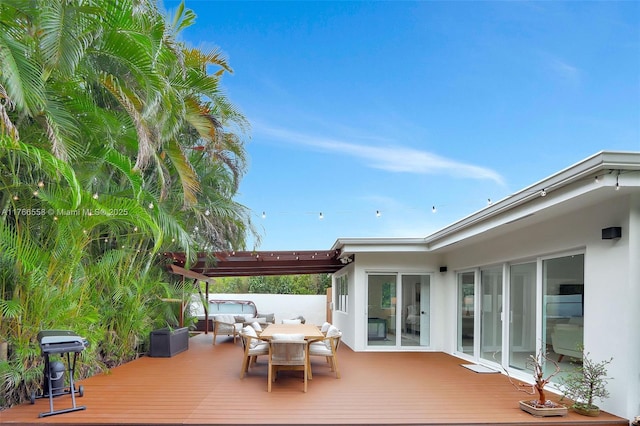 wooden terrace featuring a pergola and outdoor dining space