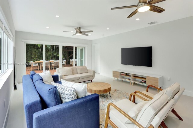 living area with ceiling fan, recessed lighting, and visible vents