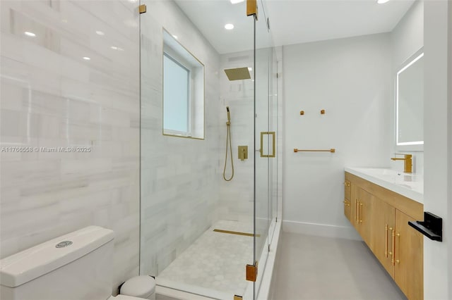 bathroom featuring a shower stall, baseboards, toilet, recessed lighting, and vanity