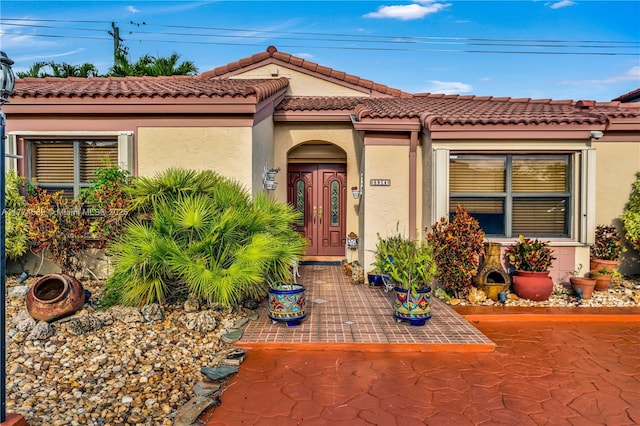 8914 SW 5th Ln, Miami, FL 33174 - doorway to property with a tile roof and stucco siding