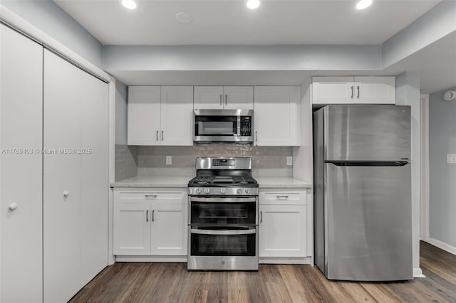 kitchen with white cabinets, light countertops, and appliances with stainless steel finishes