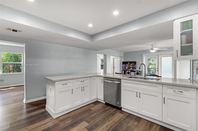 kitchen featuring white cabinetry, stainless steel dishwasher, a sink, visible vents, and a ceiling fan