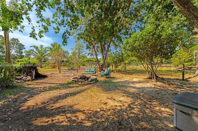 view of yard with a fire pit