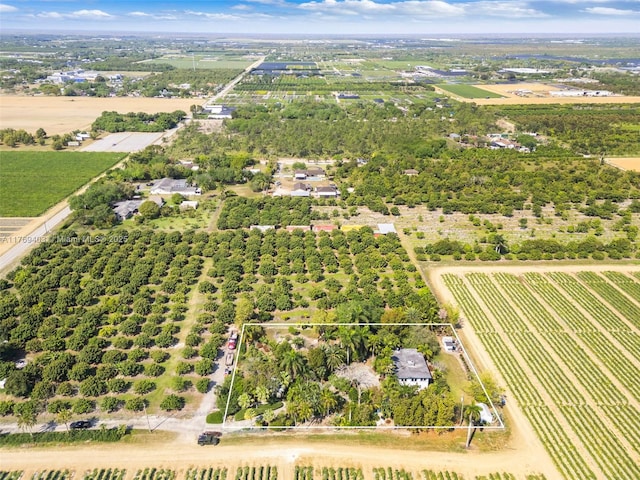 birds eye view of property featuring a rural view
