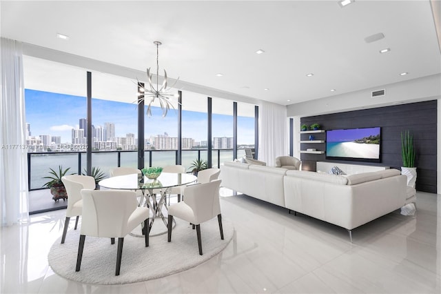 5000 Island Estates Dr Unit 704, Aventura, FL 33160 - dining area featuring a city view, recessed lighting, a wall of windows, a chandelier, and visible vents