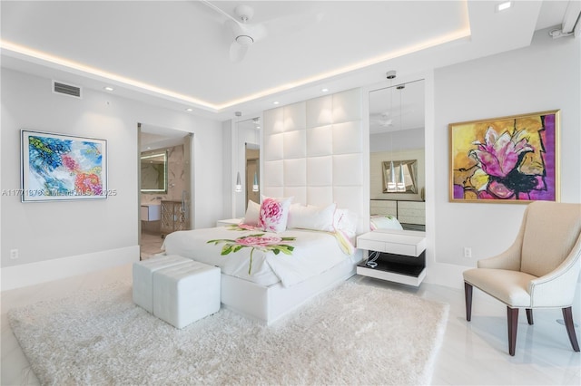 5000 Island Estates Dr Unit 704, Aventura, FL 33160 - bedroom featuring connected bathroom, visible vents, recessed lighting, and a raised ceiling