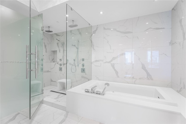 5000 Island Estates Dr Unit 704, Aventura, FL 33160 - bathroom with marble finish floor, a marble finish shower, tile walls, and a bath