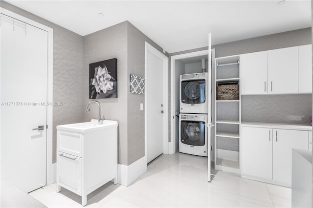 5000 Island Estates Dr Unit 704, Aventura, FL 33160 - laundry area featuring stacked washer and dryer, a sink, and laundry area