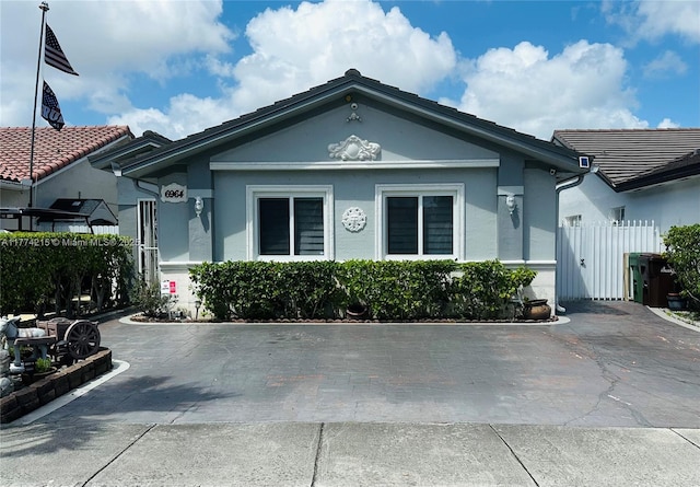 6964 W 30th Ave, Hialeah, FL 33018 - view of front of house with stucco siding and fence