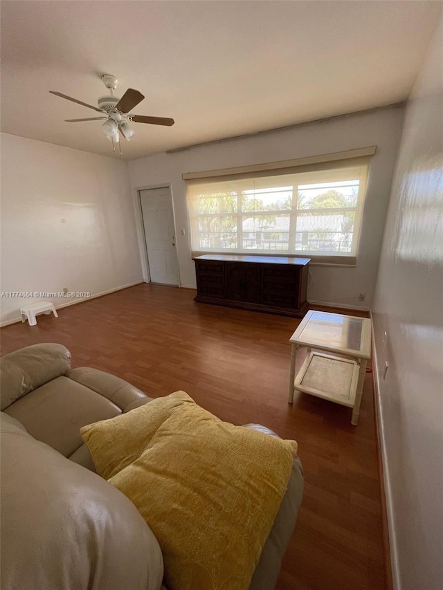 230 SW 11th Ave Unit 15, Hallandale Beach, FL 33009 - living area with wood finished floors, ceiling fan, and baseboards