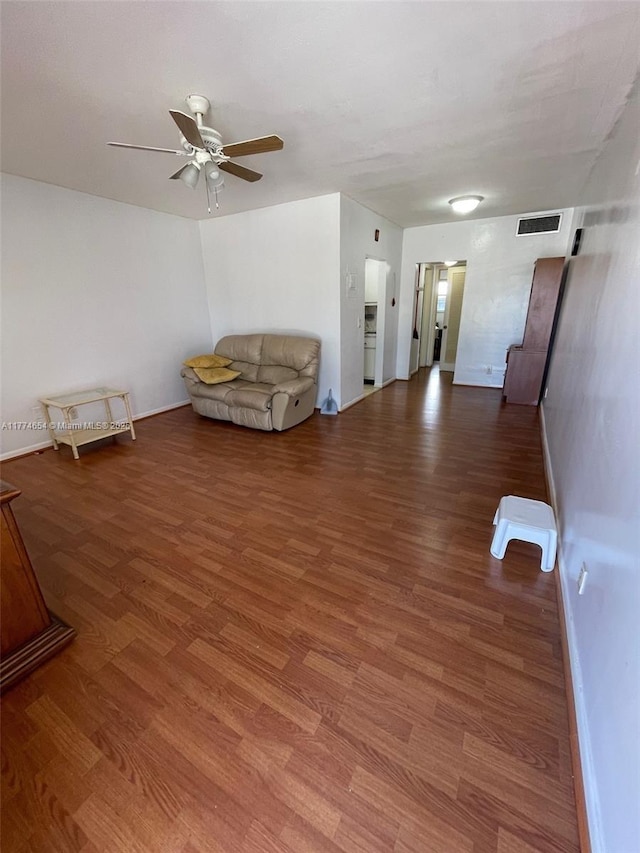 230 SW 11th Ave Unit 15, Hallandale Beach, FL 33009 - unfurnished living room with ceiling fan, wood finished floors, and baseboards