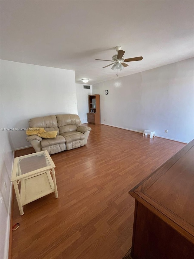 230 SW 11th Ave Unit 15, Hallandale Beach, FL 33009 - living area featuring ceiling fan and wood finished floors