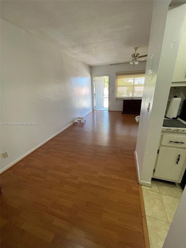 230 SW 11th Ave Unit 15, Hallandale Beach, FL 33009 - spare room with ceiling fan, light wood finished floors, and baseboards