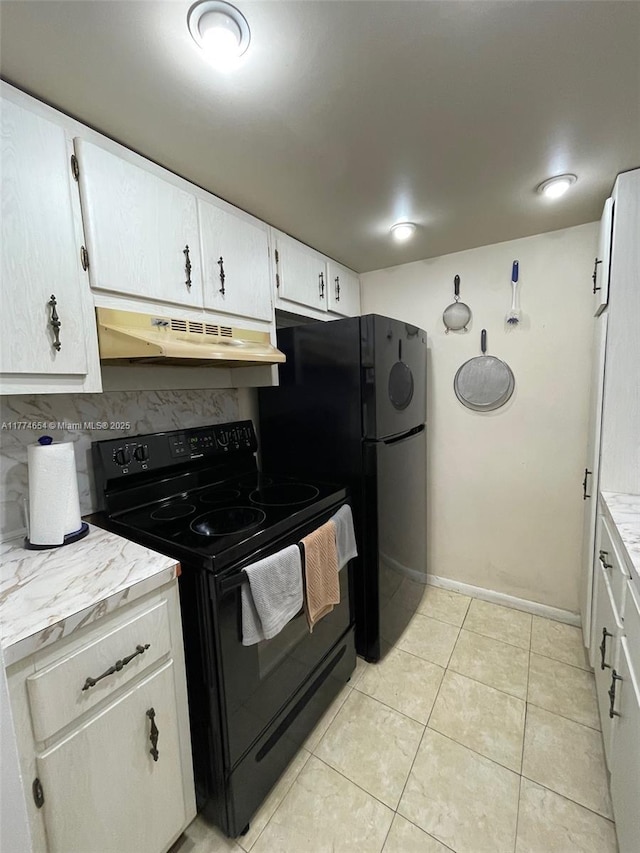 230 SW 11th Ave Unit 15, Hallandale Beach, FL 33009 - kitchen featuring under cabinet range hood, black appliances, light countertops, light tile patterned floors, and white cabinets